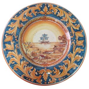 Piatto cap. prete Ø 35 c/veliero ornato fondo blu